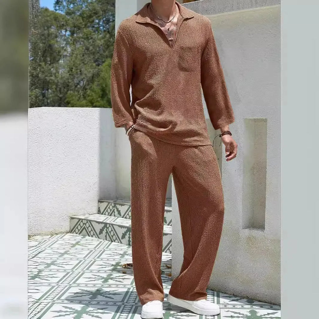 Man wearing a lake blue casual shirt and matching trousers from a polyester suit set.