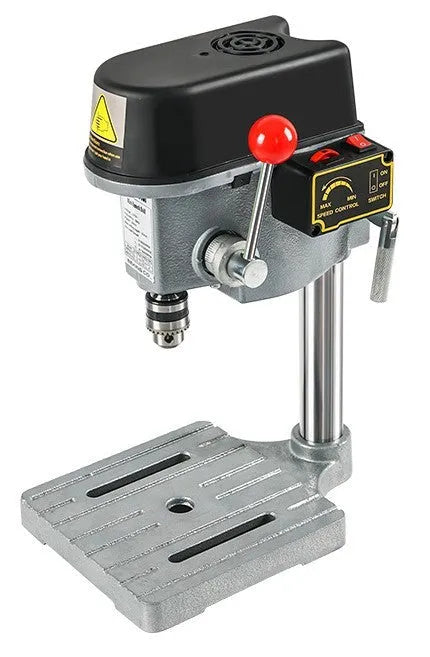 Mini bench drill milling machine with cross bench pliers on workbench