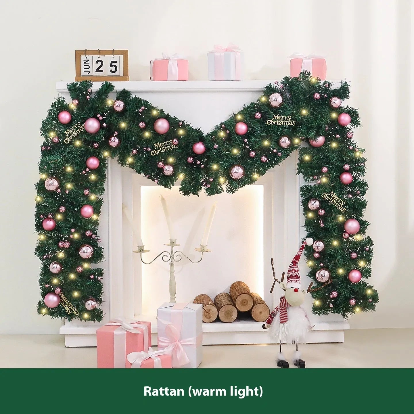 Pink artificial Christmas rattan vine garland with fairy lights draped on a mantelpiece