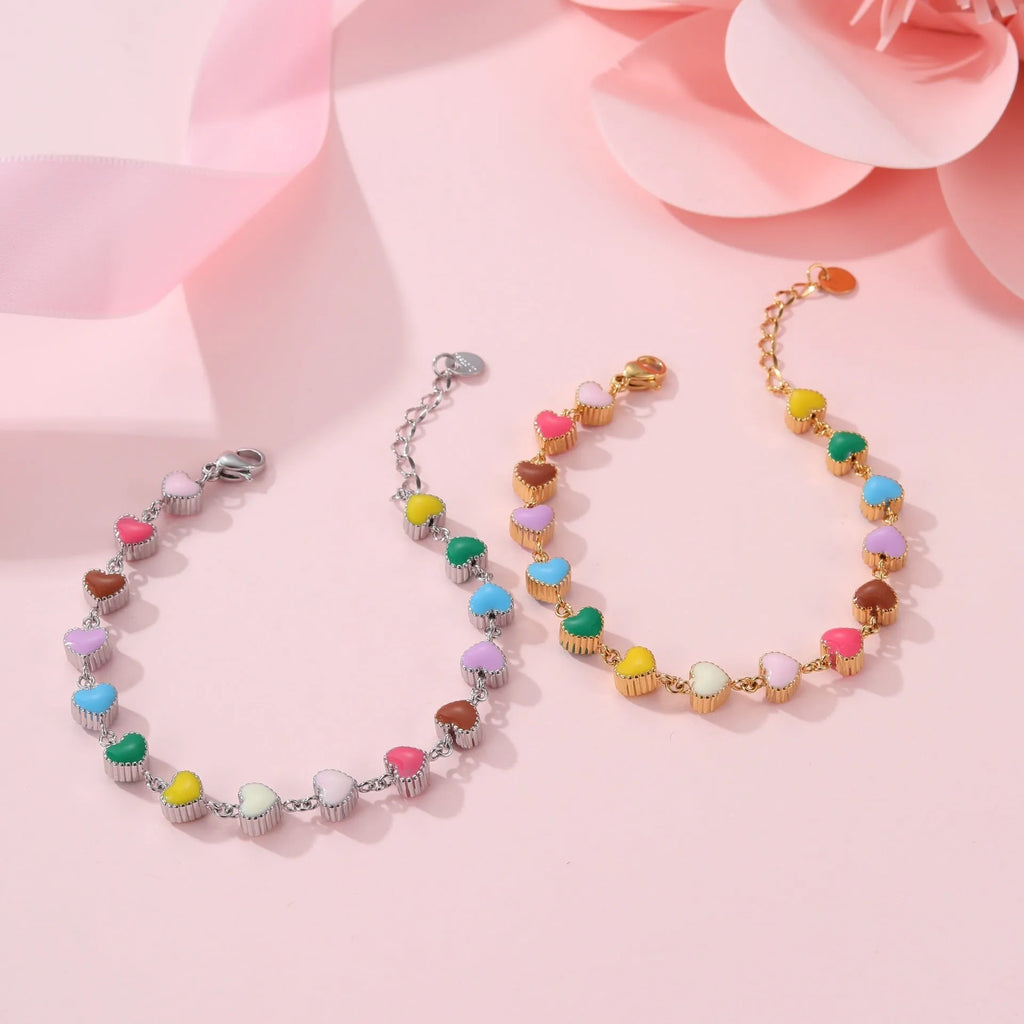 Women's adjustable heart pendant bracelet with colourful oil accents in gold or steel finish