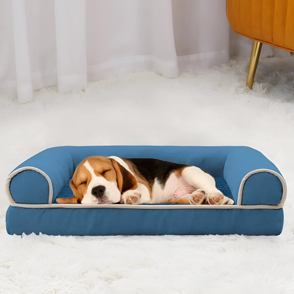 Square sponge dog bed with a breathable, washable cloth cover shown in a blue colour.