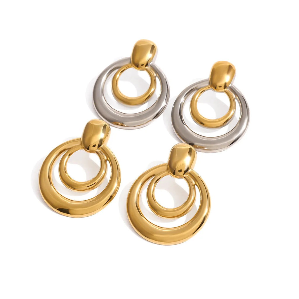 Golden round titanium steel hollow stud earrings with double layer construction and hypoallergenic properties