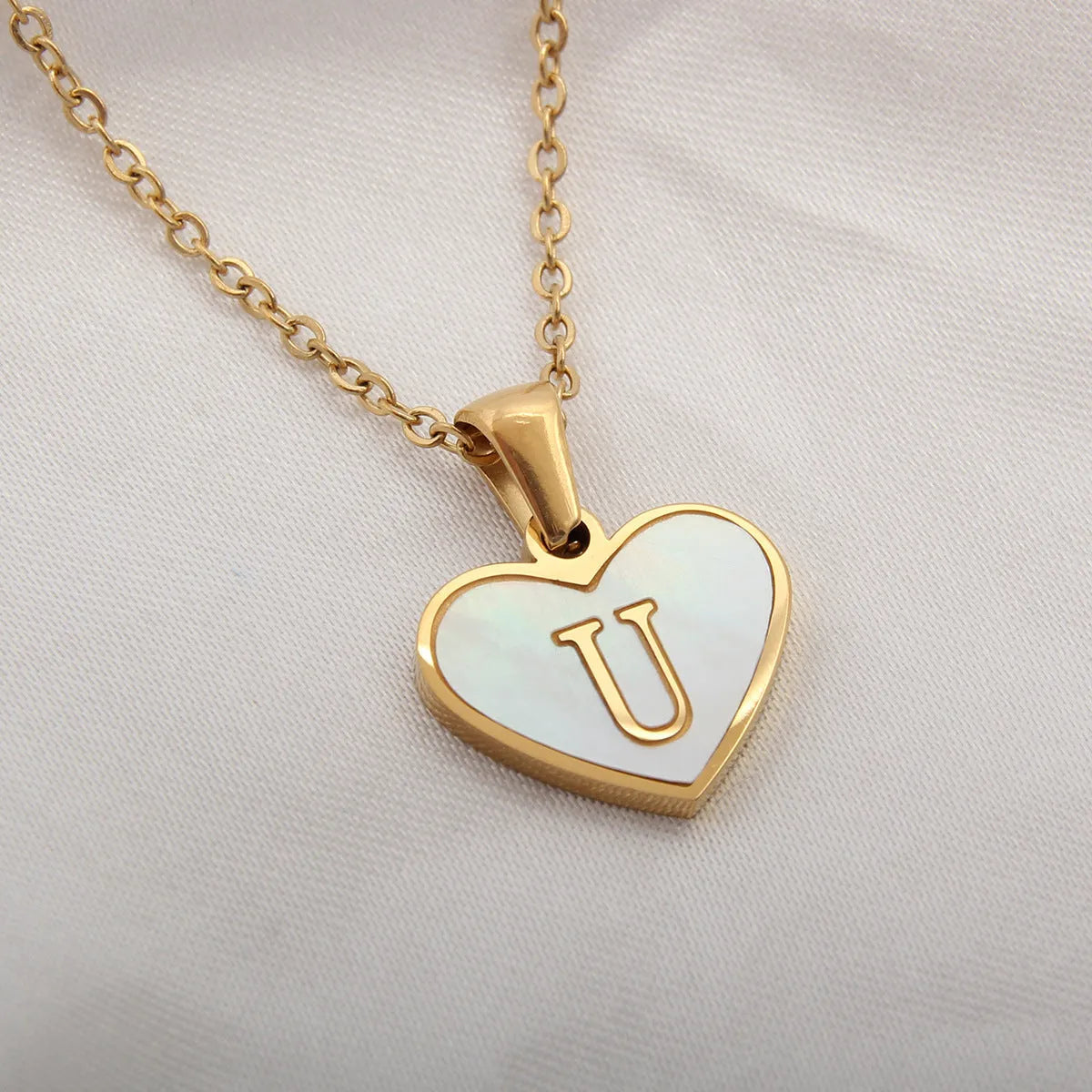 Gold plated personalised heart necklace with white shell on a 45cm chain