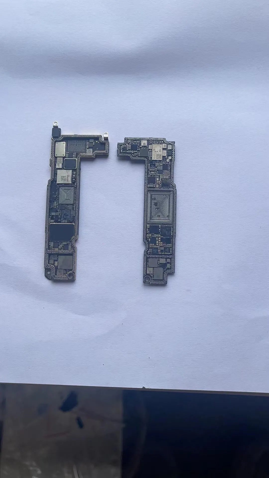 Silver iPhone 13 Pro Mini motherboard for board-level repair and ID grinding procedures
