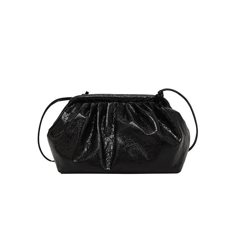 Shell-shaped shoulder crossbody bag with hair clip closure in rose red colour showing interior organisation compartments