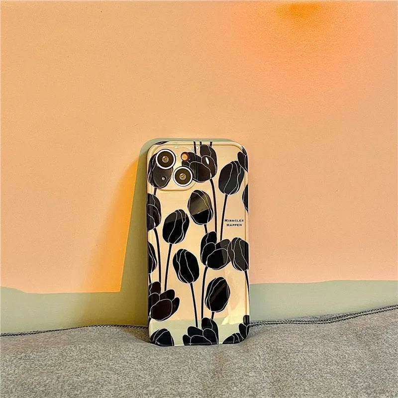 Black tulip patterned silicone iPhone case shown on an iPhone