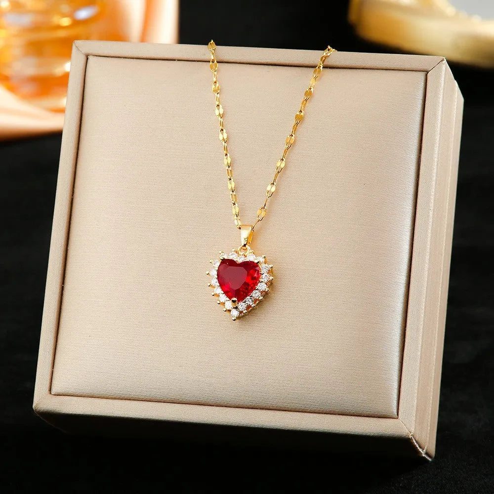 Gold red titanium steel jewellery set with hearts and flower pendant including necklace, ear studs, and ring