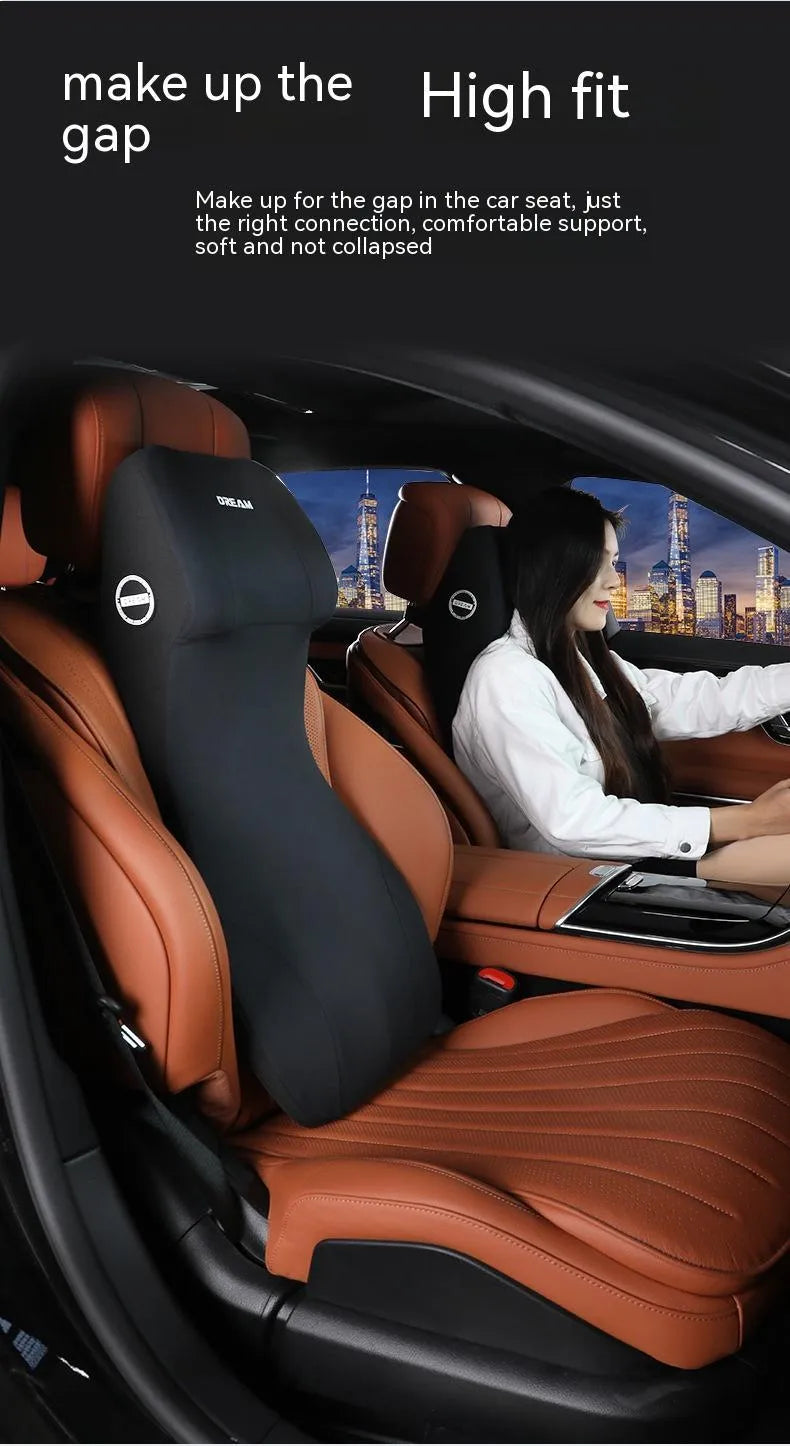 Black automotive memory foam headrest and lumbar cushion combined in one piece on a car seat.