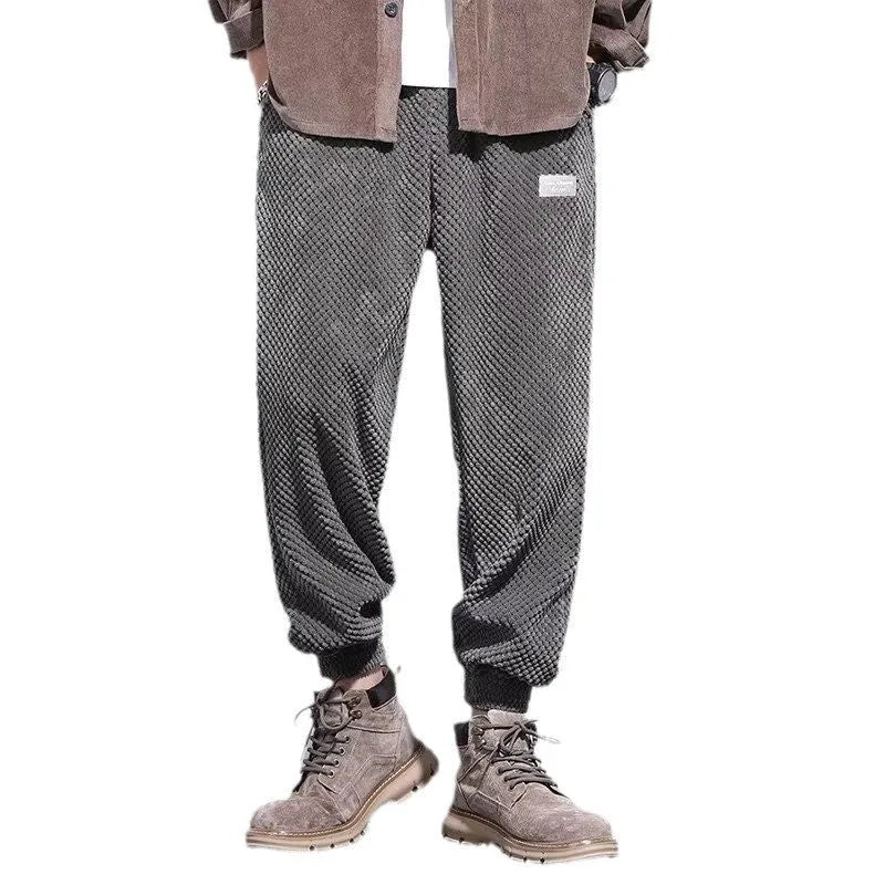 Men's grey ankle-tie casual sweatpants with straight leg design on hanger