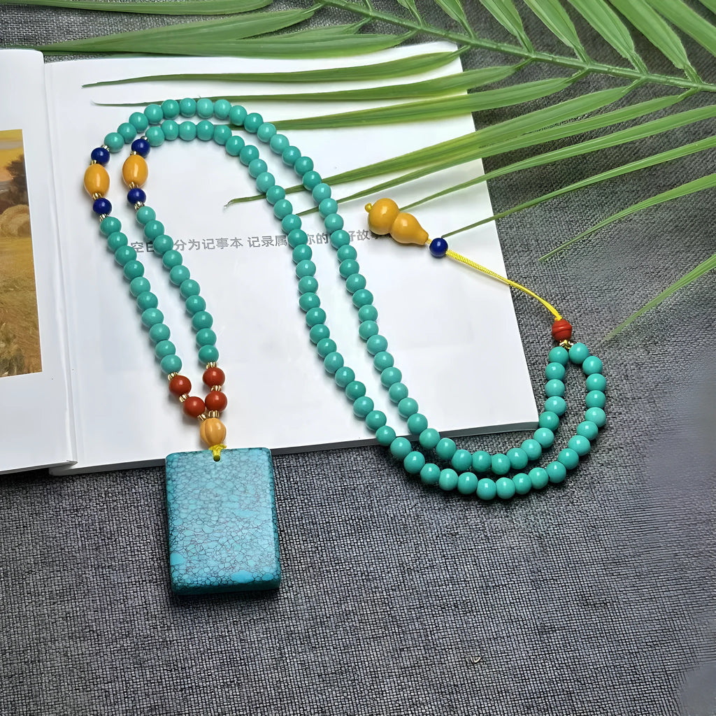 Turquoise mesh flower lucky pendant necklace with ball bead chain, adjustable length.