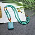 Turquoise mesh flower lucky pendant necklace with ball bead chain, adjustable length.