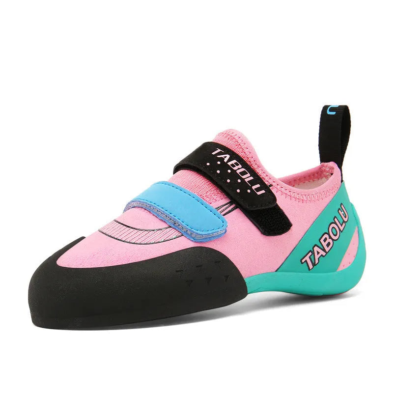 Beginner rock climbing shoes with Velcro strap in black and red colour.