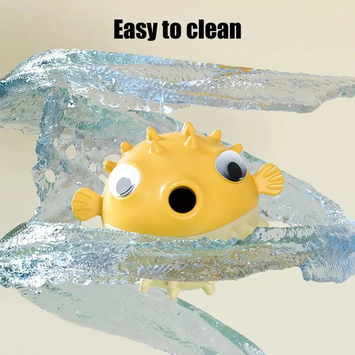 Yellow vinyl fish-shaped dog chew toy with textured surface for dental care