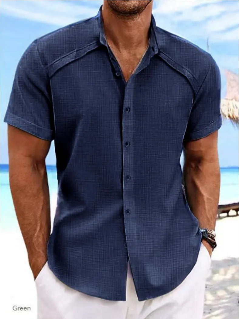 Hawaiian casual short sleeve solid colour shirt in a cotton blend fabric on a hanger.