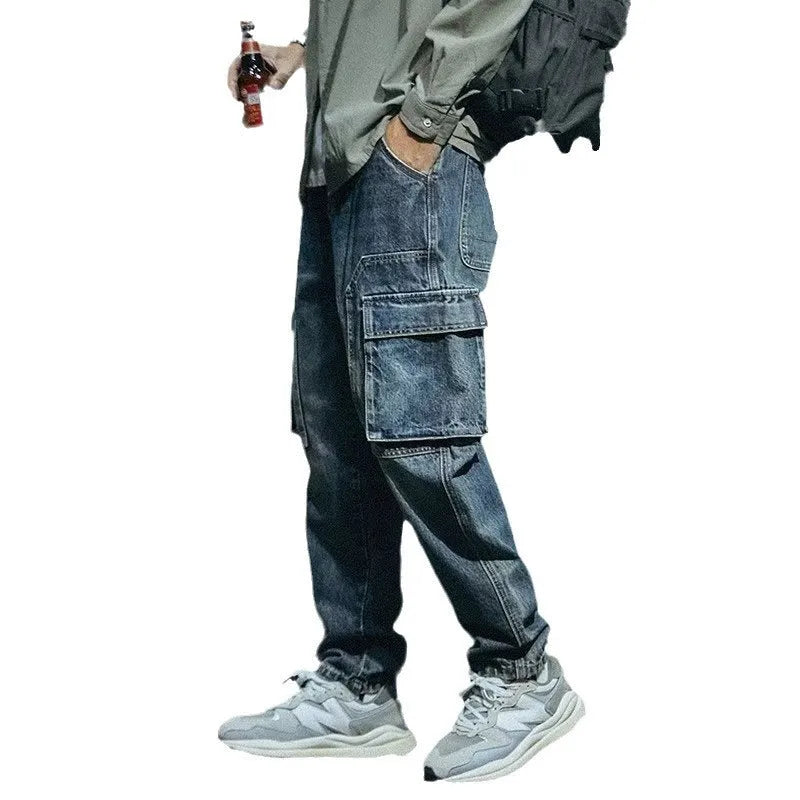 Men's blue loose straight-leg denim trousers with zip fly on mannequin