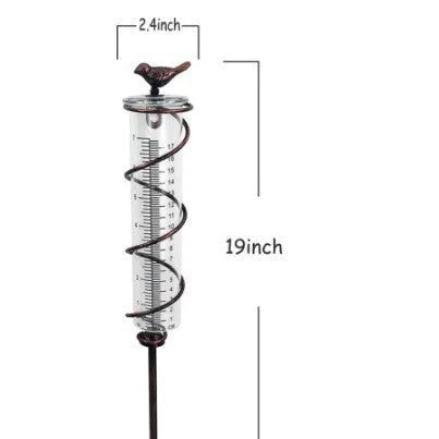 Cast iron bird-shaped garden rain gauge with glass measurement tube showing 1-20 scale