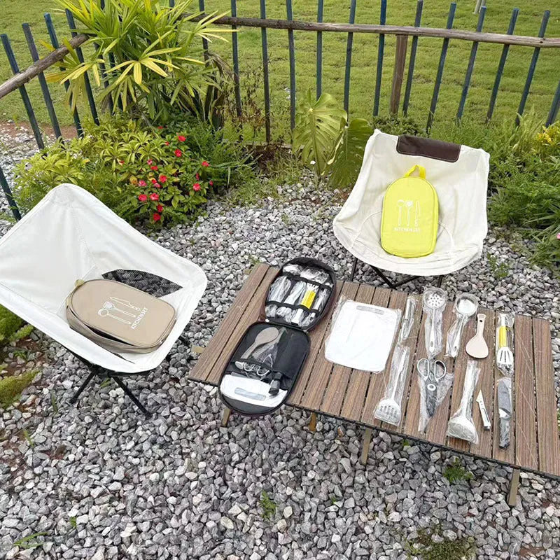 12-piece stainless steel picnic utensil set inside a khaki portable storage bag for outdoor dining.