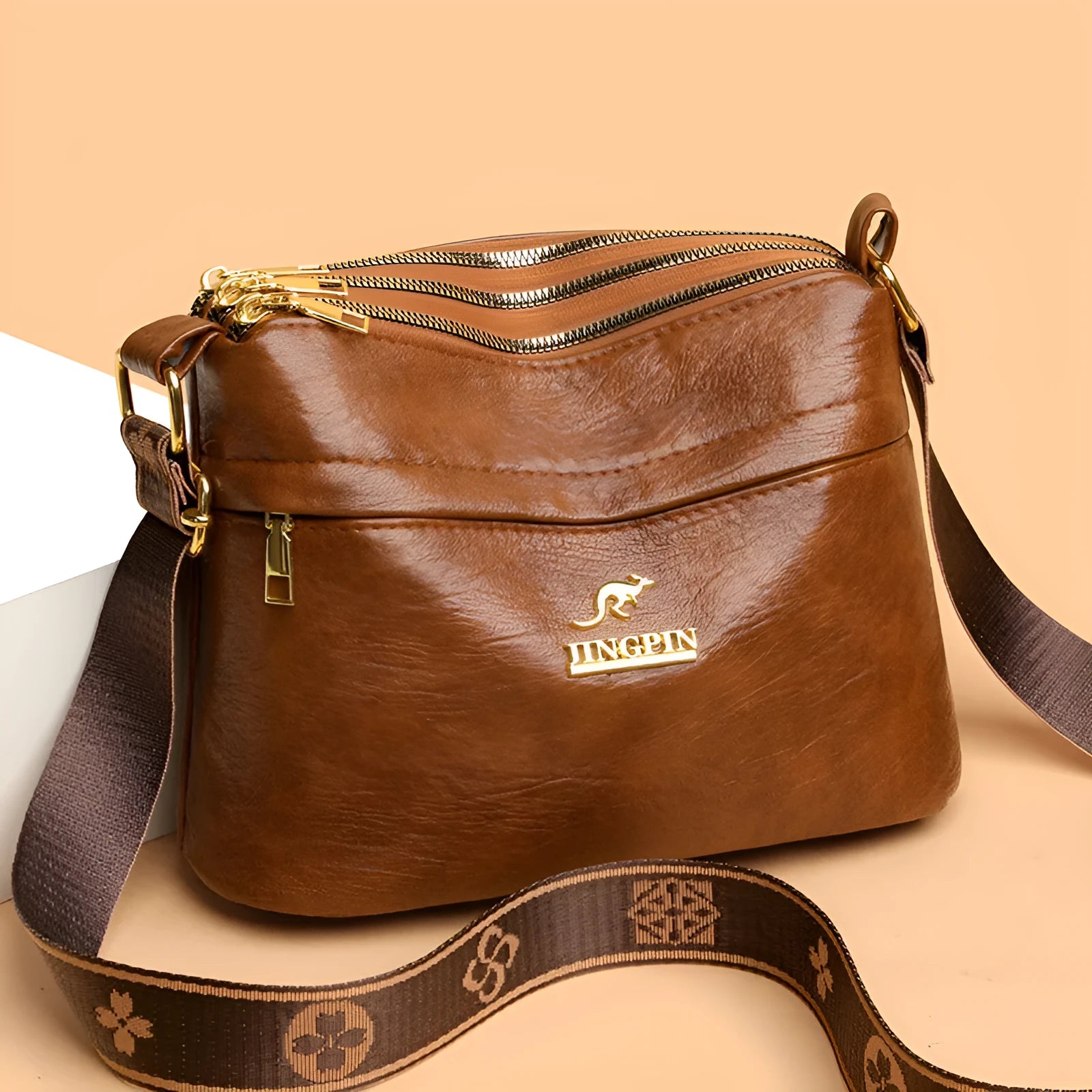 Large capacity multi compartment cross body bag in black with horizontal square shape and sewing thread detail