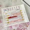 Set of five blue nurse-themed retractable ballpoint pens with plastic casing.