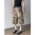 Yellow snake camouflage cropped jeans on a denim background