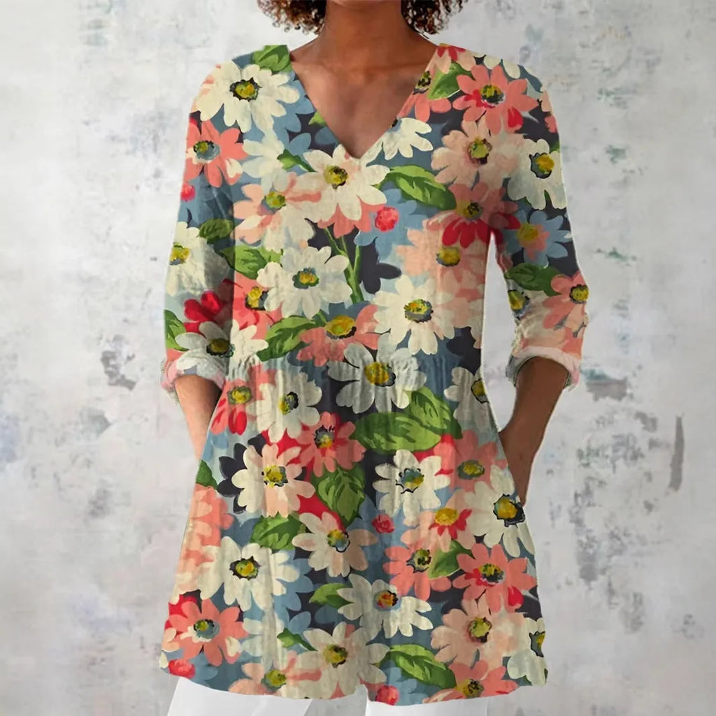 Woman wearing a retro slim fit, digitally printed long-sleeved top in a floral design.