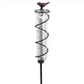 Cast iron bird-shaped garden rain gauge with glass measurement tube showing 1-20 scale