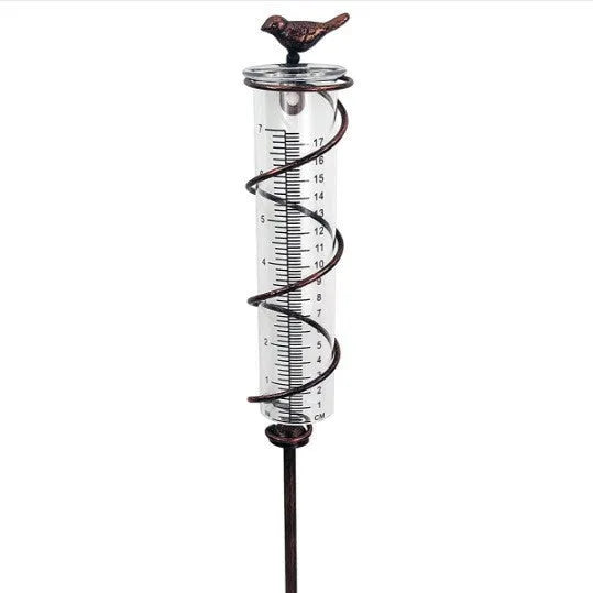 Cast iron bird-shaped garden rain gauge with glass measurement tube showing 1-20 scale
