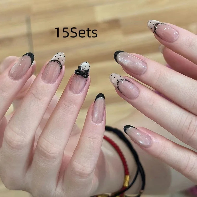 False nails with hand-glued crystal decorations in random mixed colours creating 3D nail art designs