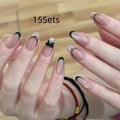False nails with hand-glued crystal decorations in random mixed colours creating 3D nail art designs