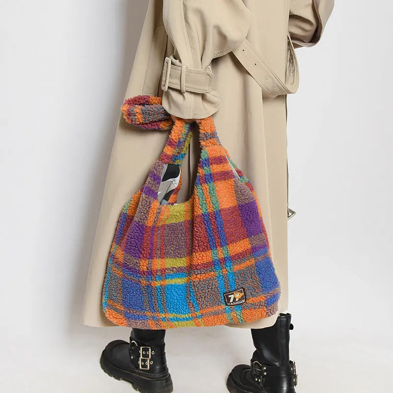 Women's plaid crossbody shoulder bag in soft plush fabric showing horizontal square shape and large capacity