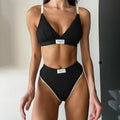 Women's embroidered bikini set with contrast binding letters in black colour showing sleeveless top and shorts