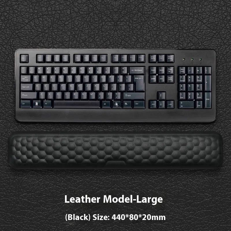 Customisable memory foam mouse wrist pad with black cloth cover on a desk.