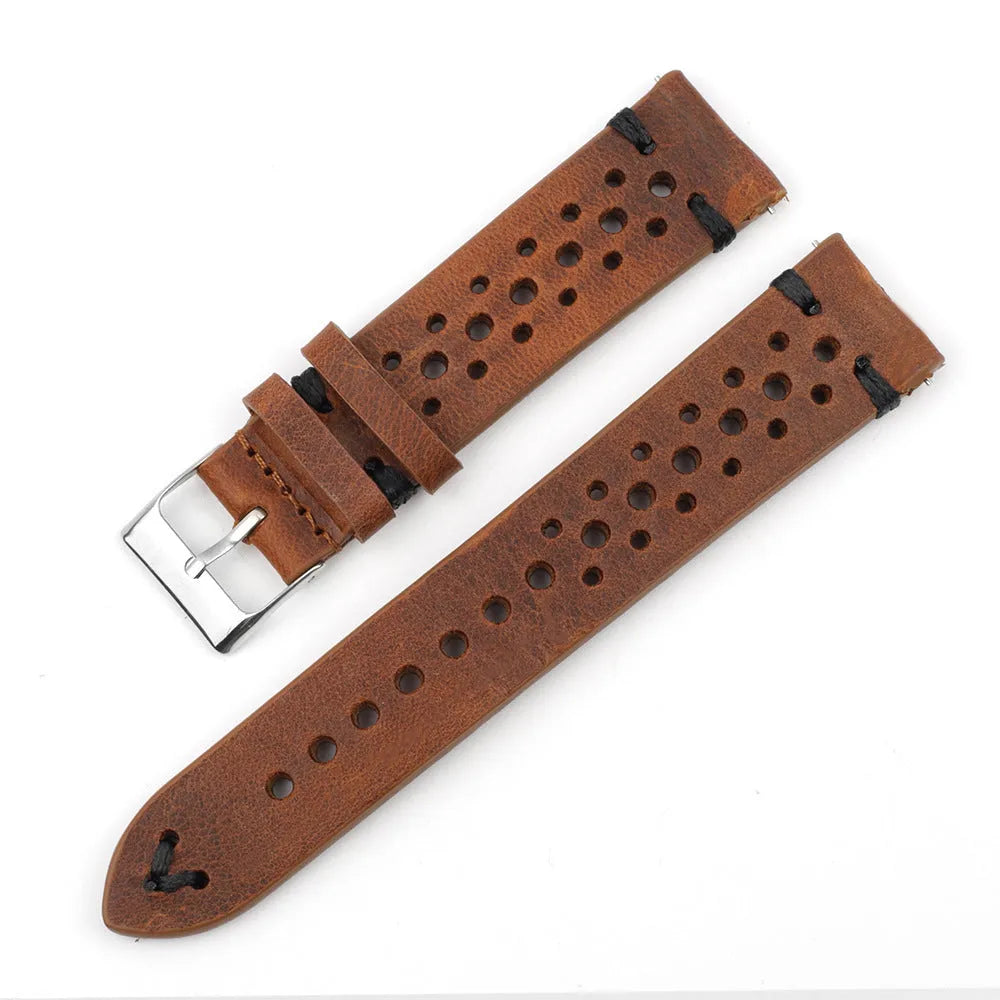 Handmade retro genuine leather watch band in brown with white stitching on a wooden surface
