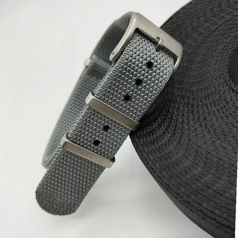 Nylon quick-release watch strap in army green colour showing integrated spring bars