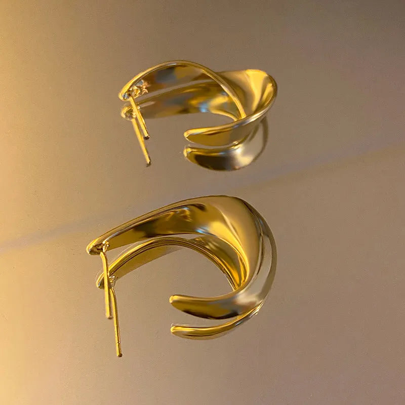 Geometric twisted metal earrings in gold or silver electroplated finish