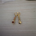 A pair of women's heart-shaped alloy earrings in gold or silver electroplated finish.