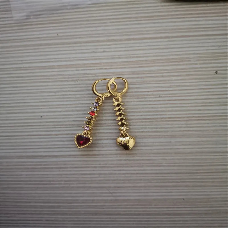 A pair of women's heart-shaped alloy earrings in gold or silver electroplated finish.