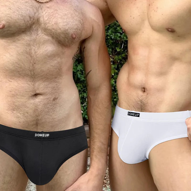 Men's solid colour seamless low waist briefs in white, shown flat.