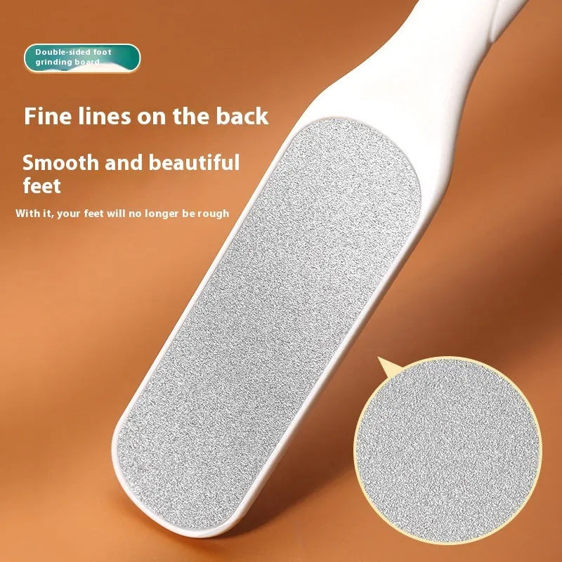 Stainless steel foot grinder tool with white and black double-sided sandpaper files for callus removal.
