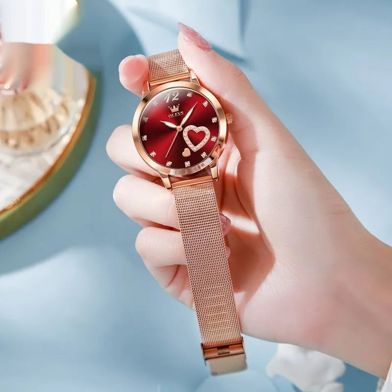 Women's rose gold fashion watch with mesh strap showing choice of six dial colours: white, black, blue, red, pink, green.