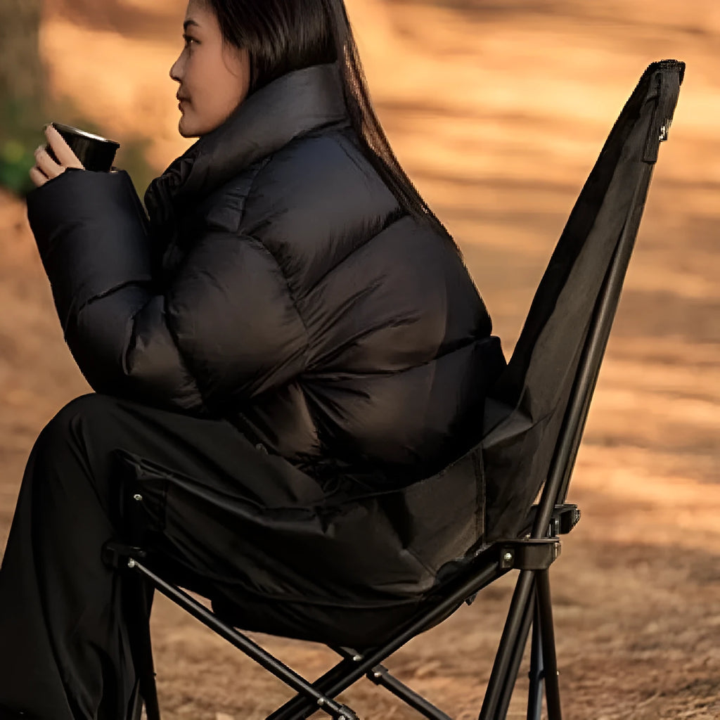 Night black Oxford cloth camping recliner moon chair in folded and unfolded positions.