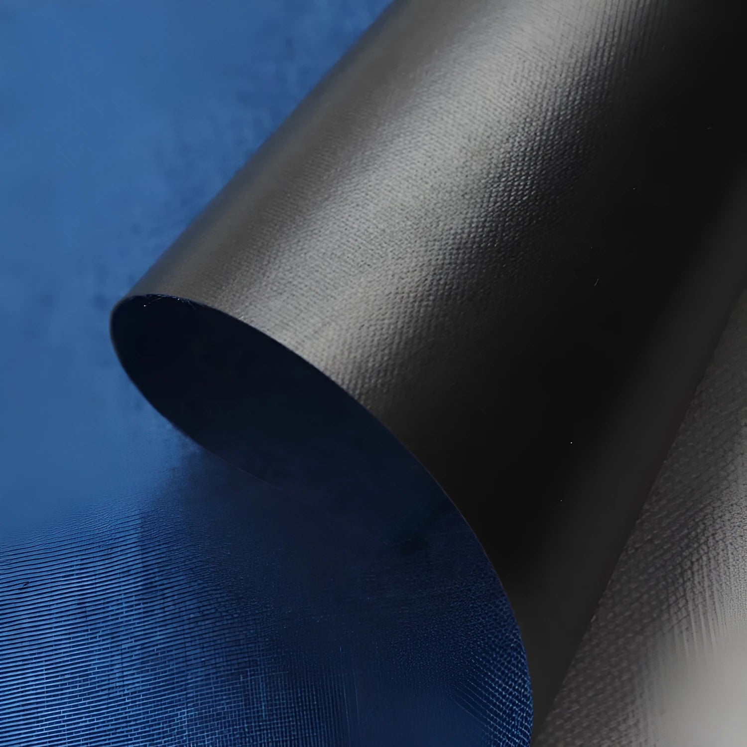 A piece of black, blue, or green polyester ant cloth fabric for luggage and furniture.