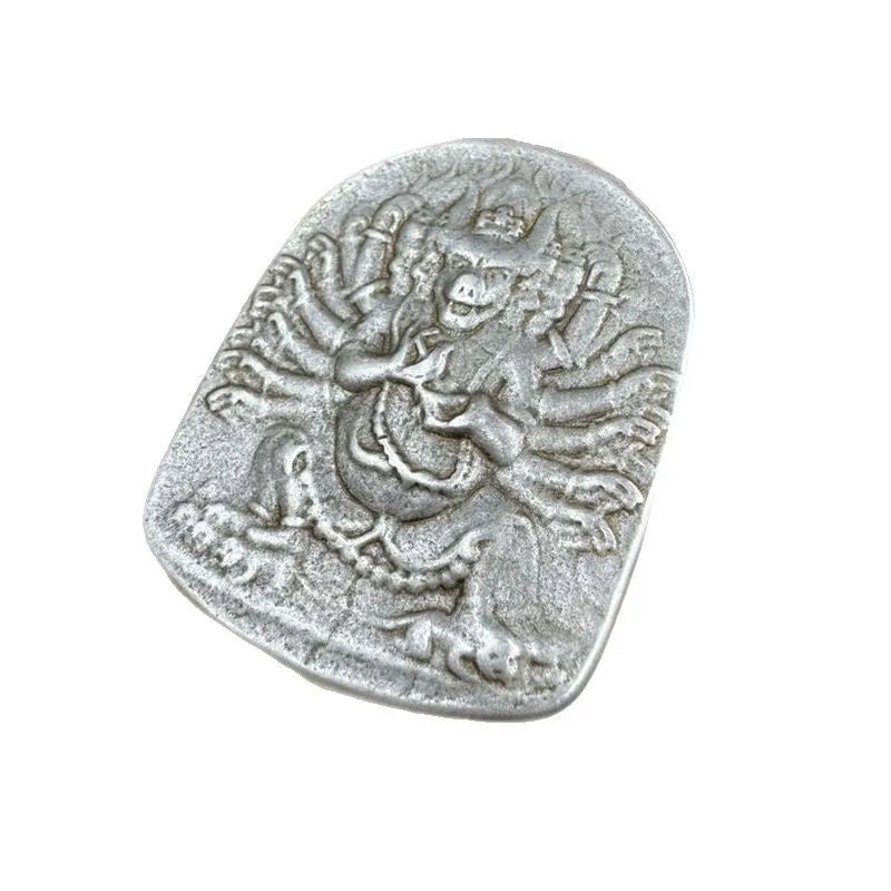 Close-up of a geometric iron pendant ornament in a Chinese style depicting the Aryaacalanatha Yamantaka motif.