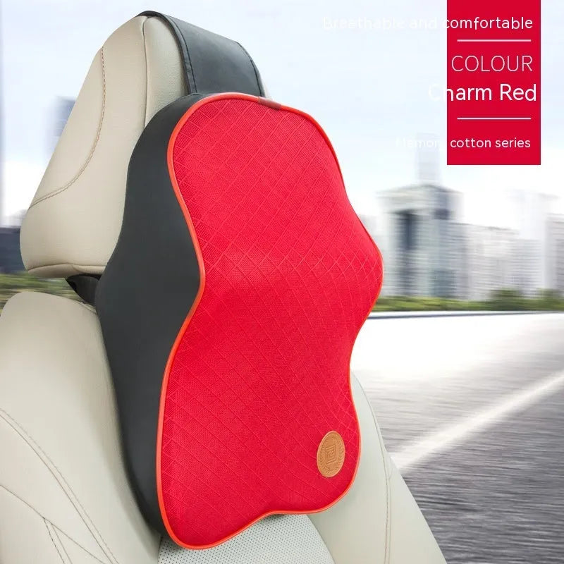 Black and brown memory foam car headrest pillow and lumbar support cushion set on a car seat.