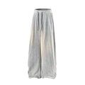 Fleece-lined straight-leg hollow-out trousers in light gray on a hanger, showing elastic waistband and textured fabric.
