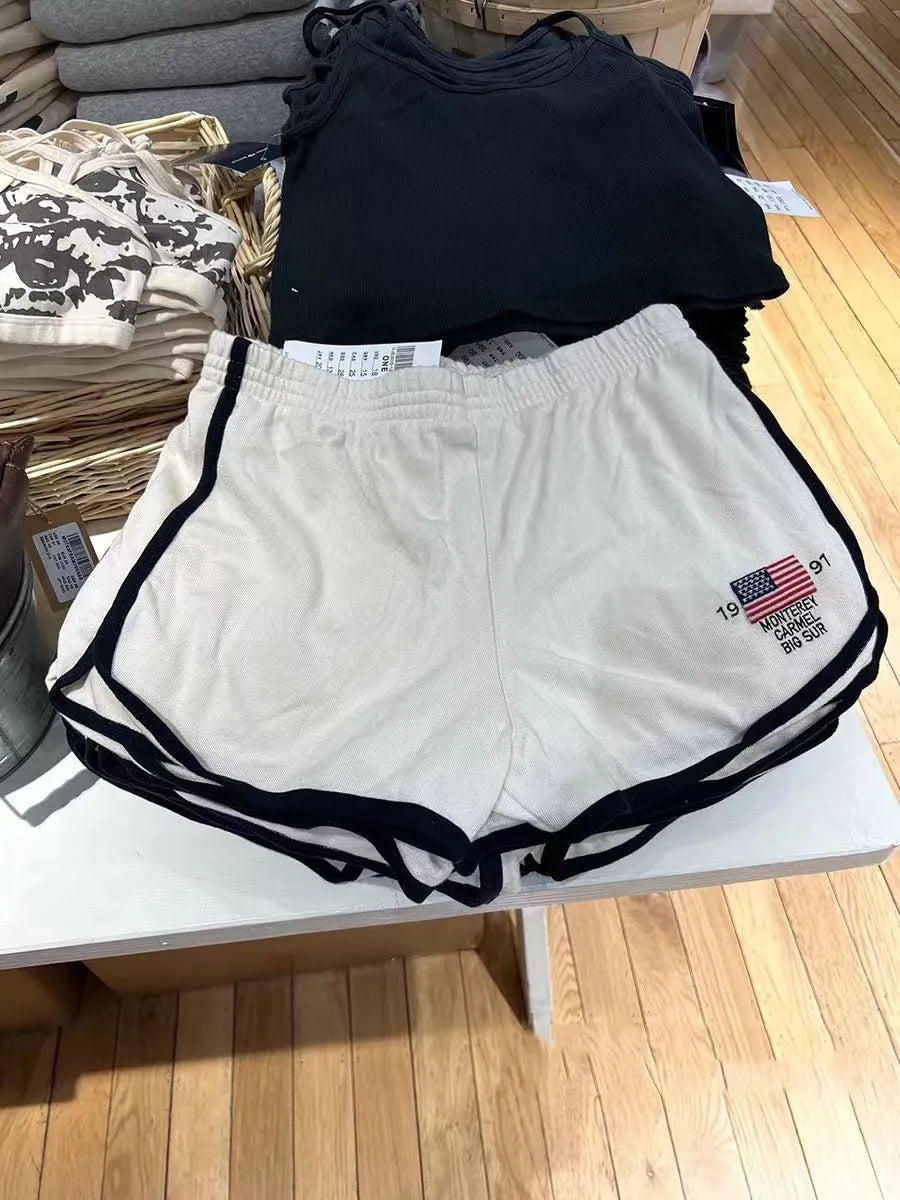 Women's dark blue cotton sports hot pants with white flag embroidery, shorts length design