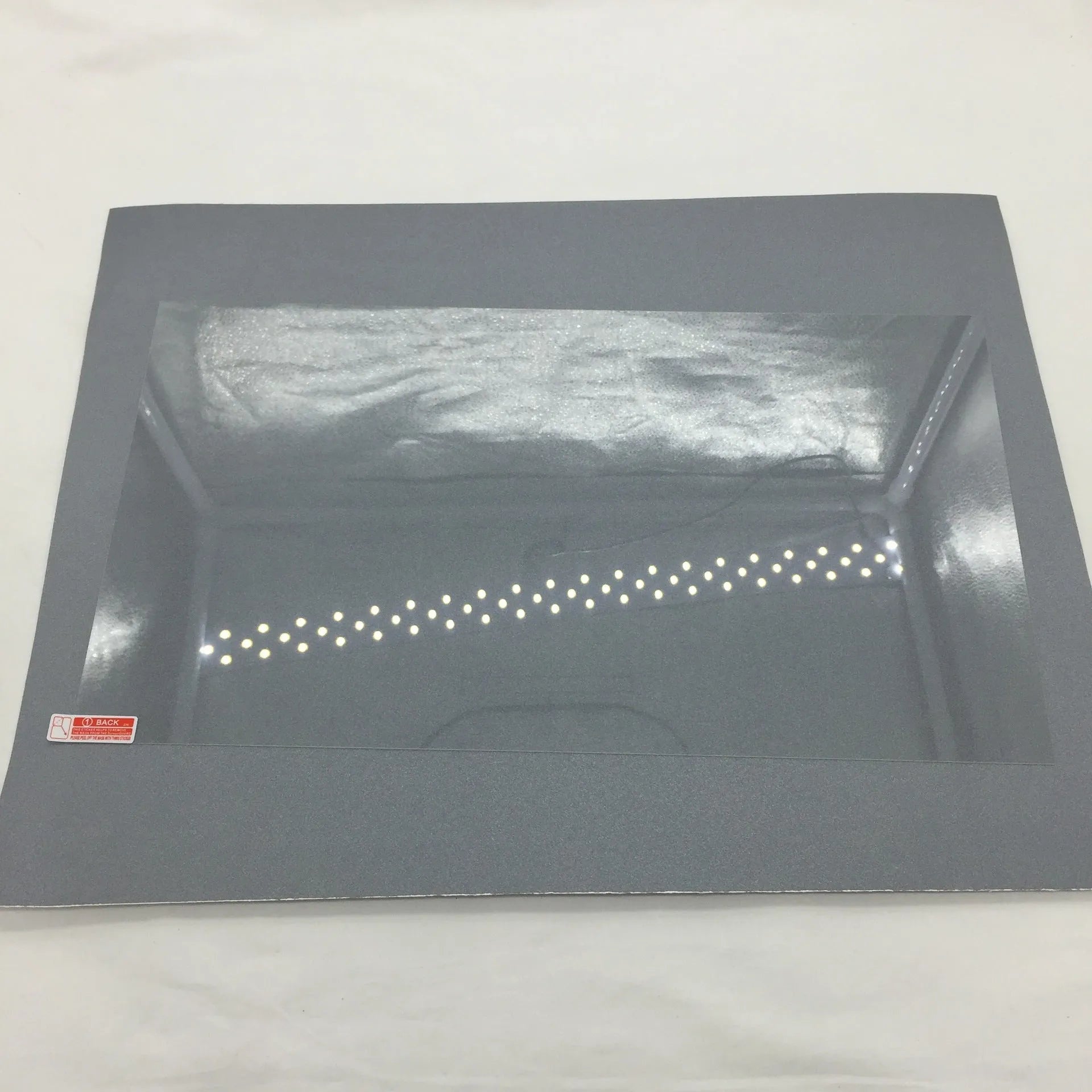 Asahi Glass tempered screen protector for 13-inch Apple MacBook Air and Pro laptops on a table.