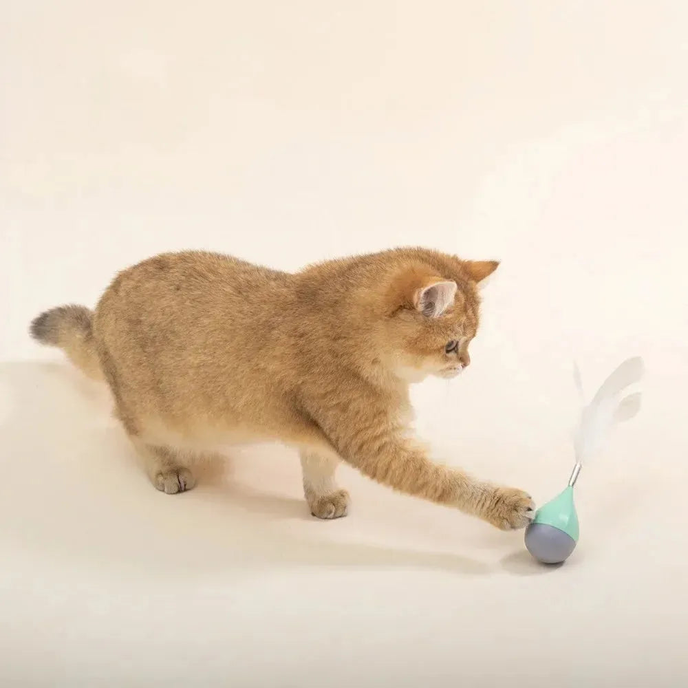 Green and pink feather tumbler cat toy with tease ball on stick
