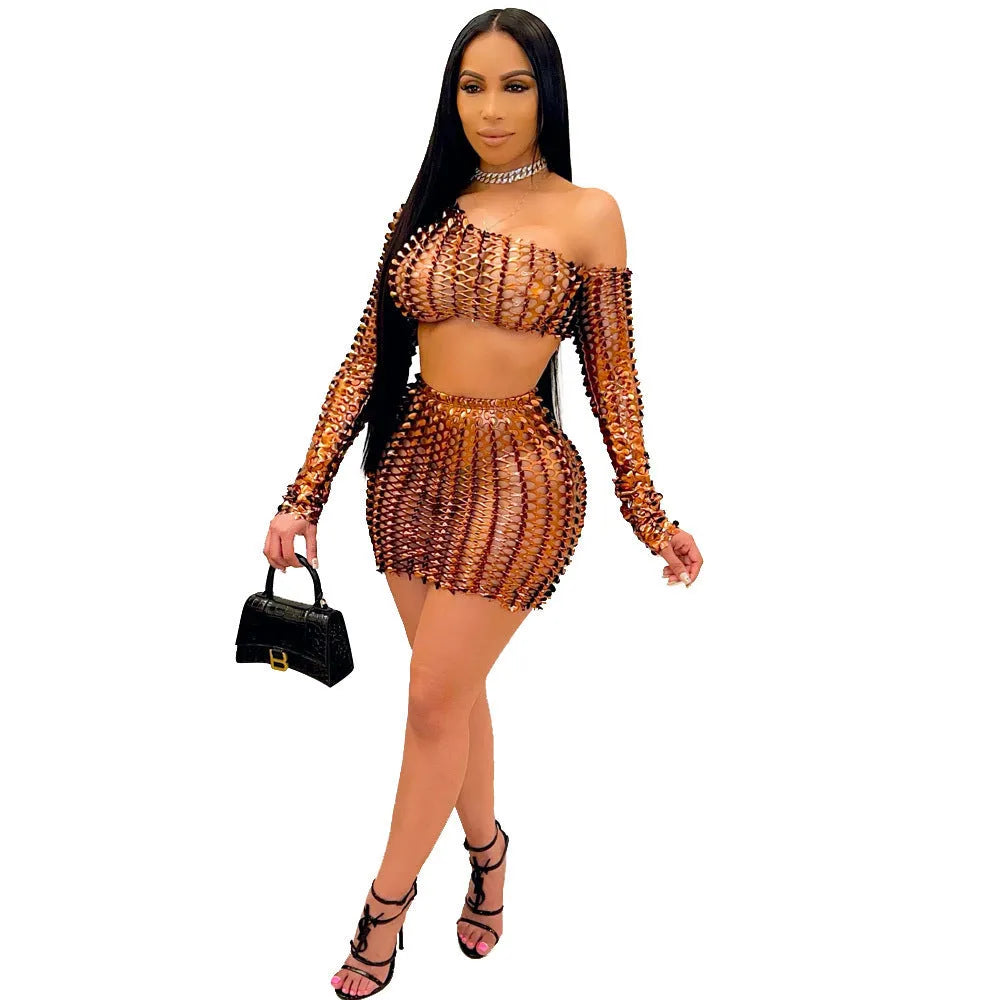 Women's black two-piece dress set with sleeveless top, short skirt, and hollow-out net detailing.