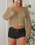 Women's short length cardigan blouse with nine-quarter bell sleeves in a hollow woven imitation cotton fabric.
